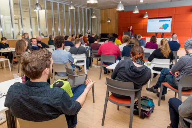 Picture of a group of people sitting in an auditorium