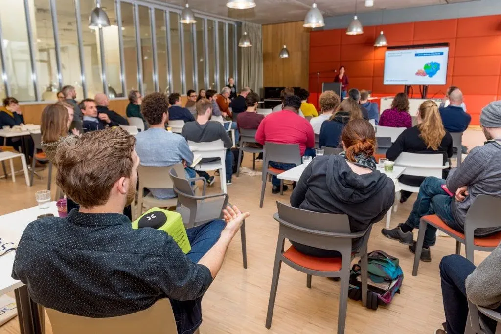 Picture of a group of people sitting in an auditorium